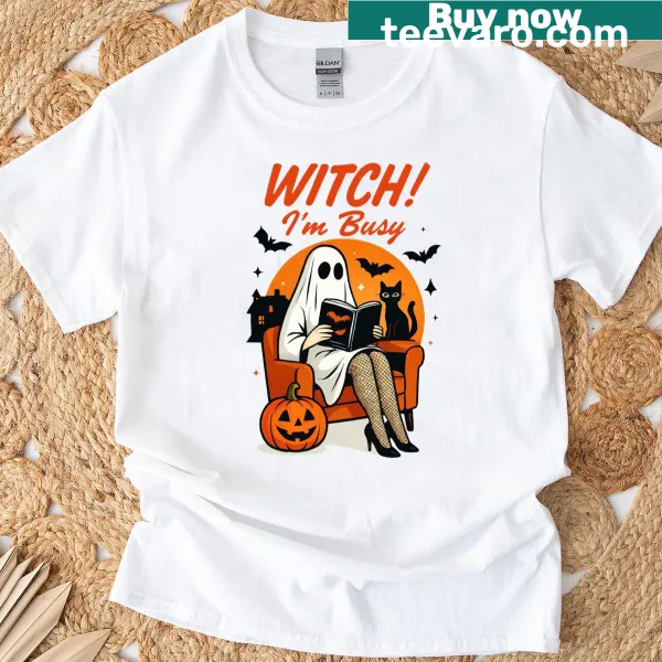 Halloween T-shirt with a witch and ghost graphic saying 'I'm Busy'