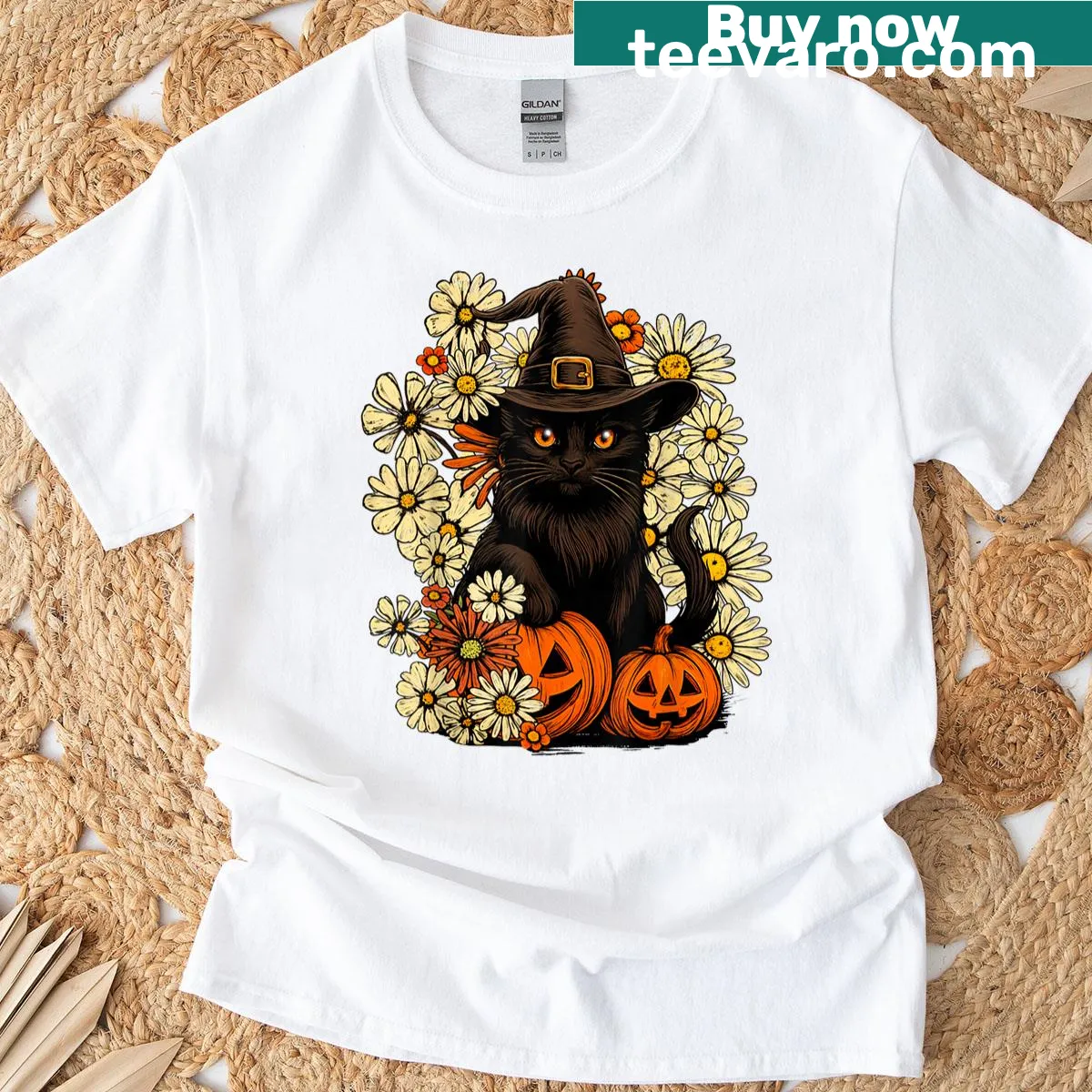 Whimsical black cat with flowers and pumpkin graphic on a t-shirt — on a men's t-shirt