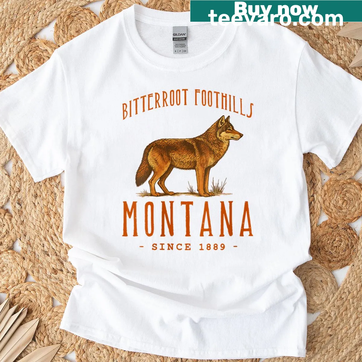 Illustrated t-shirt featuring a wolf in the Bitterroot Foothills — on a men's t-shirt