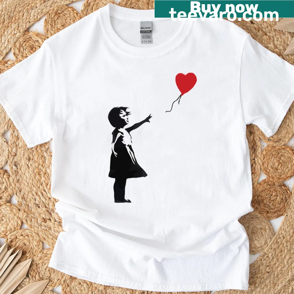 T-shirt featuring the iconic Banksy design of a girl reaching for a balloon. — on a men's t-shirt