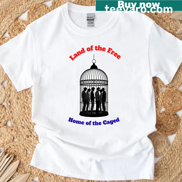 Patriotic T-shirt with the phrase 'Land Of The Free Home Of The Caged' in bold typography