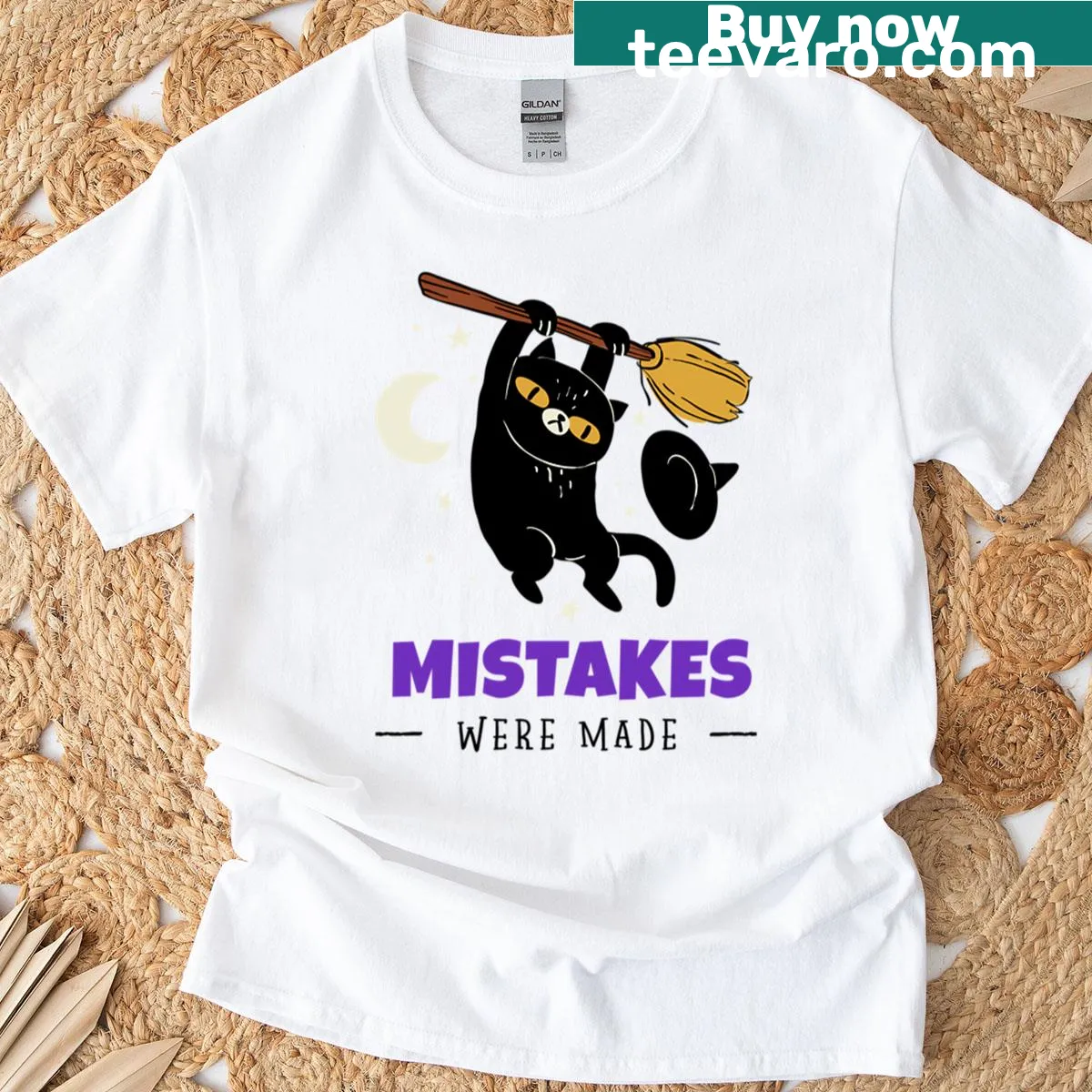 Halloween-themed T-shirt with a cat witch illustration and playful text — on a men's t-shirt