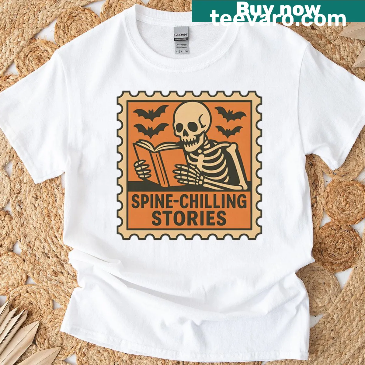 T-shirt featuring a skeleton reading in a gothic horror theme — on a men's t-shirt
