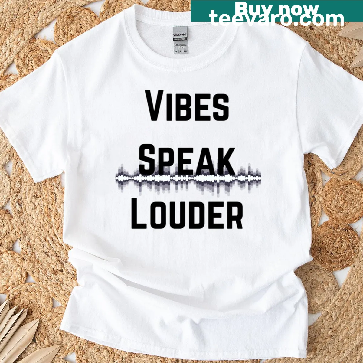 Typography T-shirt featuring the phrase 'Vibes Speak Louder Waves' — on a men's t-shirt