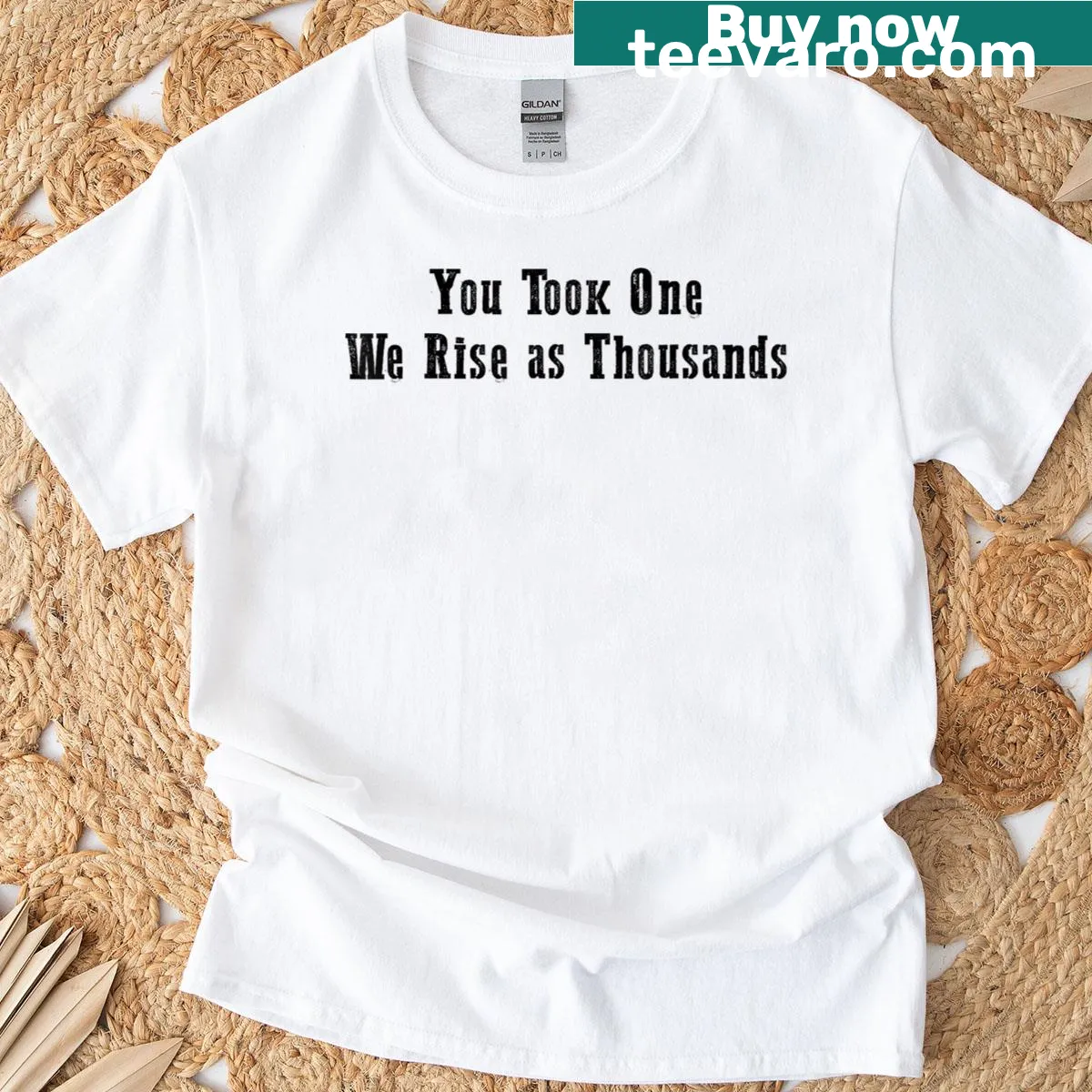 Inspirational t-shirt with the message 'You Took One We Rise As Thousands' — on a men's t-shirt
