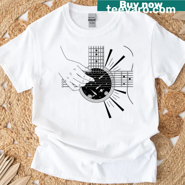 Artistic T-shirt with a hand strumming a guitar and cosmic elements