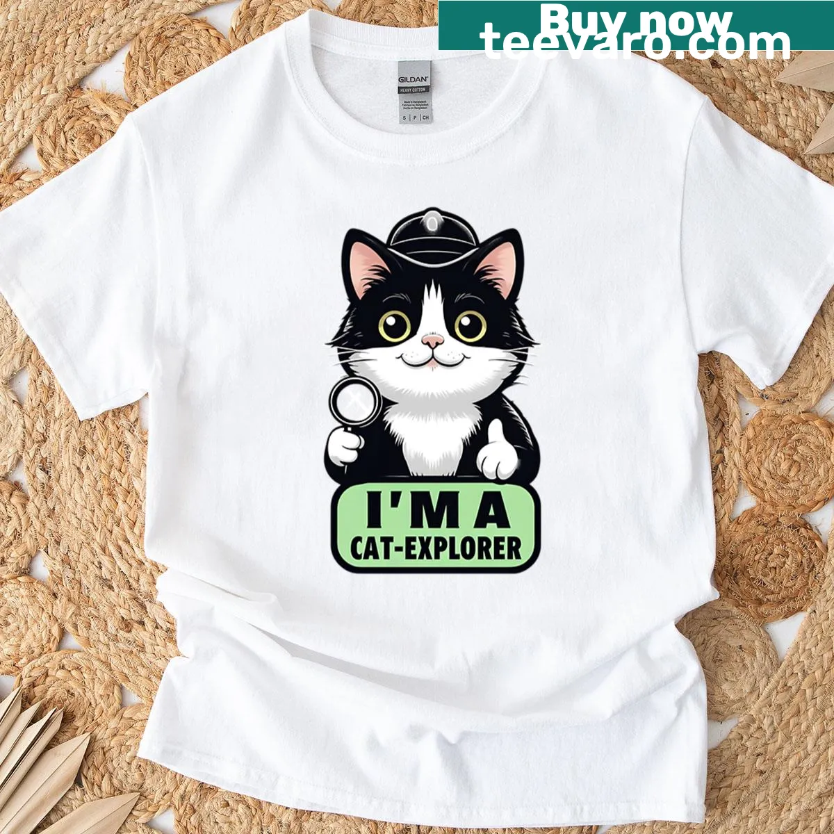 Oversized T-shirt featuring a cute cat explorer illustration — on a men's t-shirt