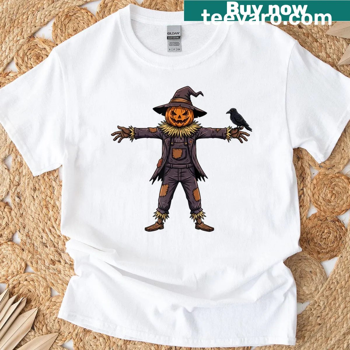 T-shirt featuring a pumpkin head scarecrow and crow design for Halloween — on a men's t-shirt