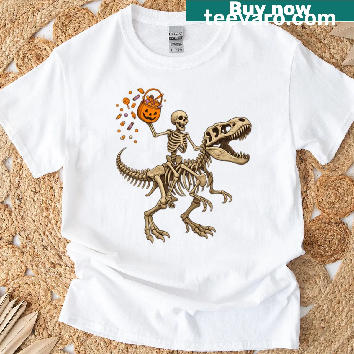 Funny graphic of a skeleton riding a T-rex skeleton on an oversized t-shirt. — on a men's t-shirt