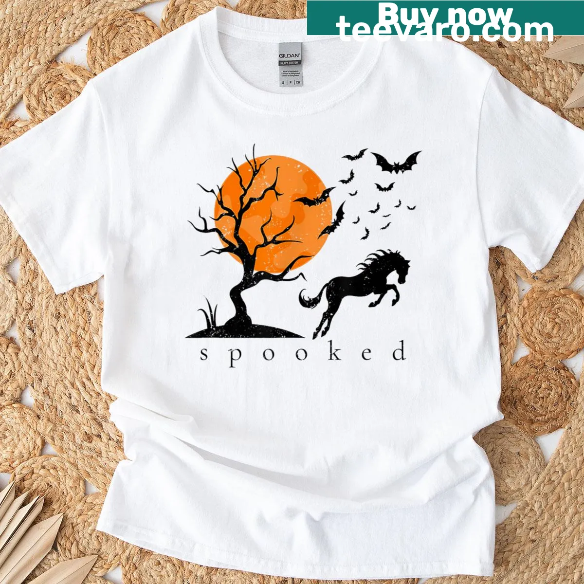 Halloween-themed t-shirt featuring a spooky horse and bats design. — on a men's t-shirt