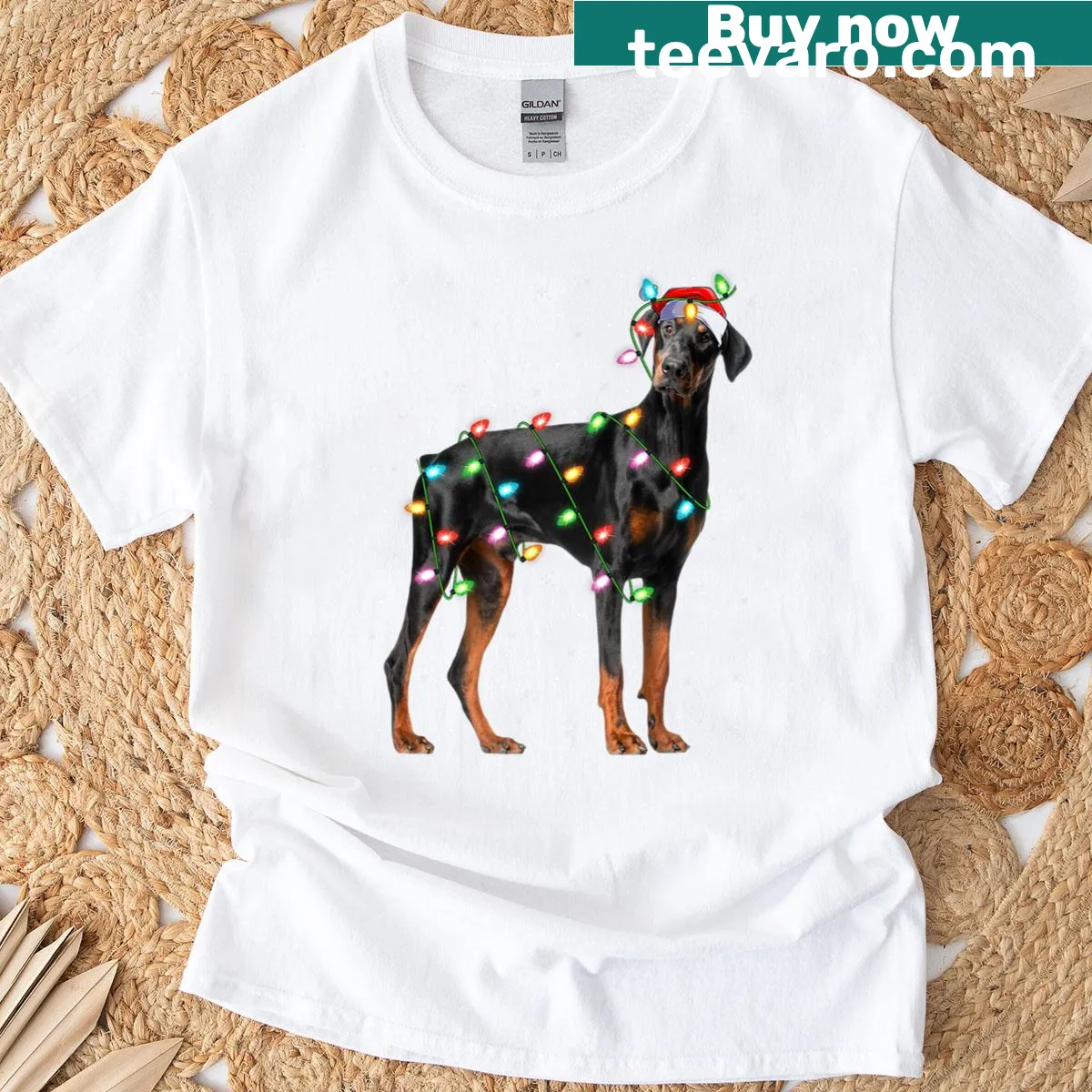 Doberman surrounded by Christmas lights and Santa design T-shirt — on a men's t-shirt