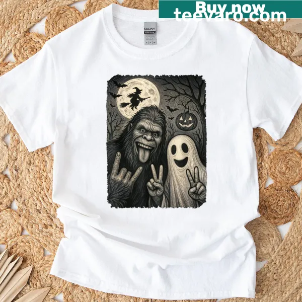 Humorous Bigfoot and ghost design on a Halloween T-shirt