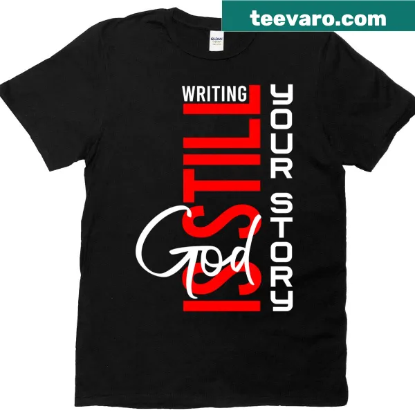Inspirational T-shirt displaying the text 'God Is Still Writing Your Story'