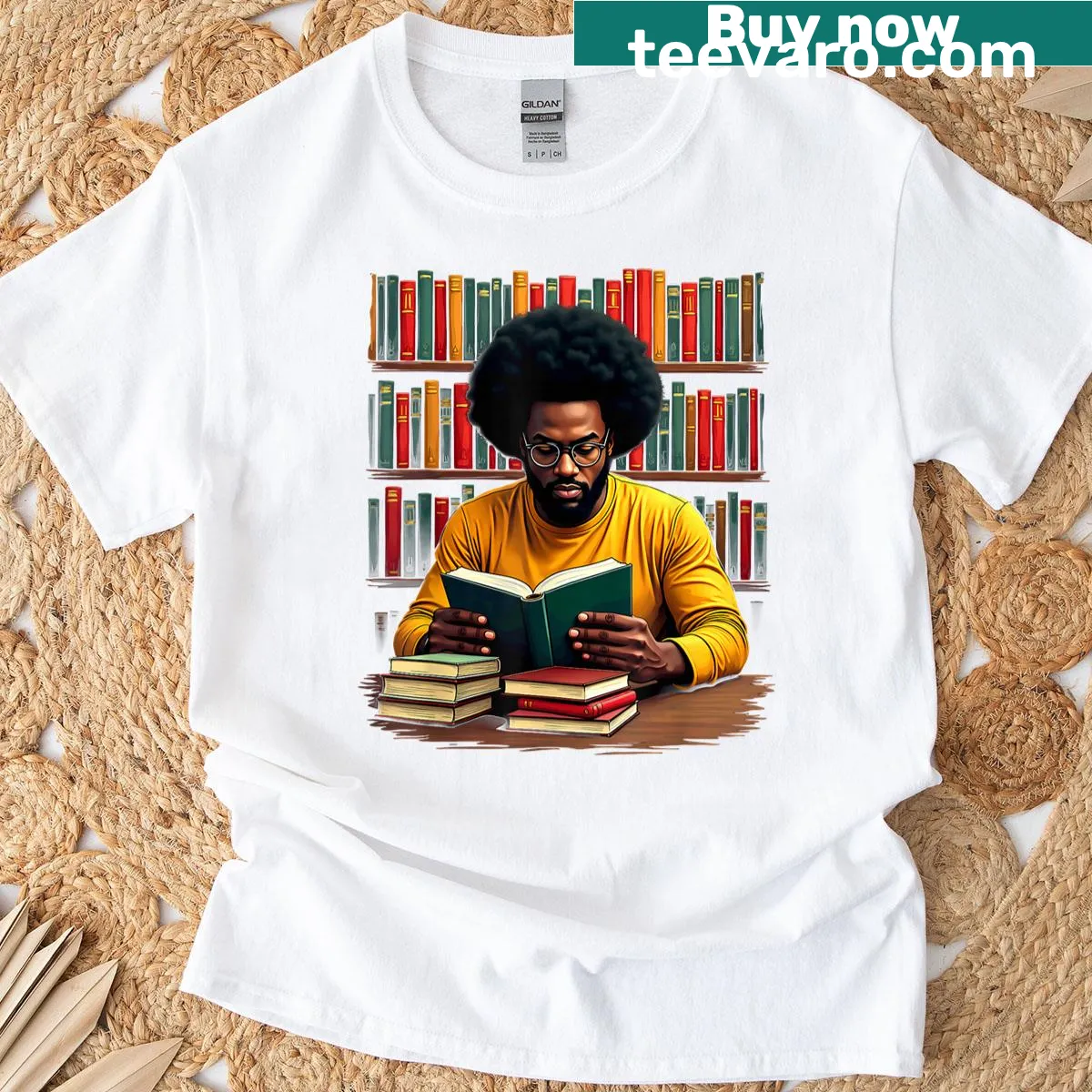T-shirt featuring a graphic of a Black man reading books, promoting education — on a men's t-shirt