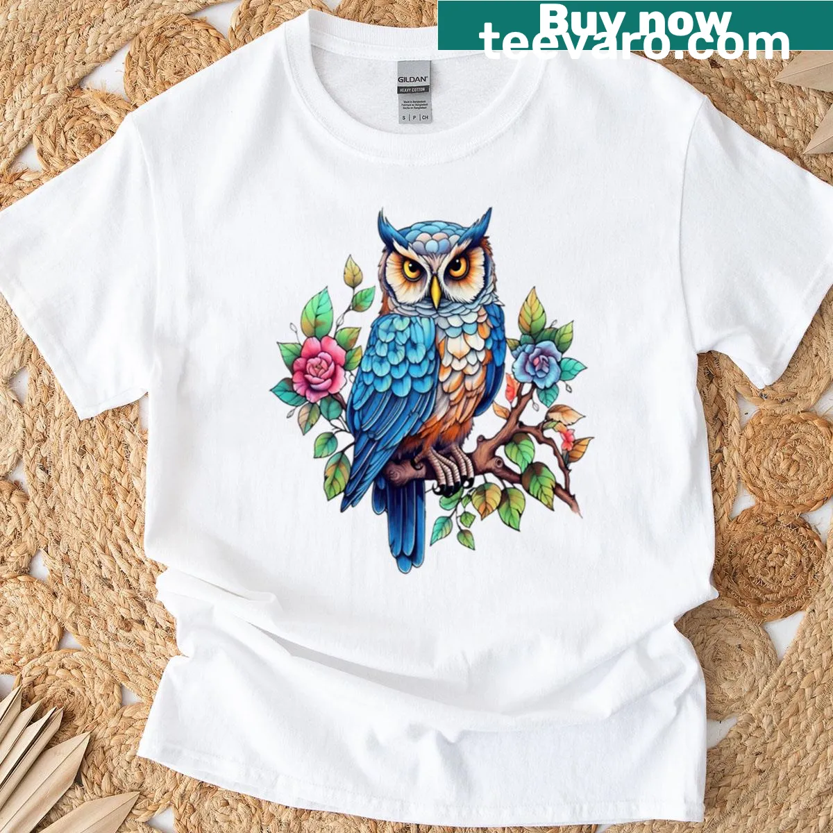Illustrated T-shirt featuring an owl on a tree branch with flowers — on a men's t-shirt