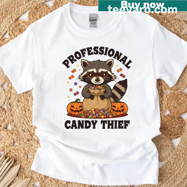 Funny Halloween t-shirt featuring a masked raccoon as a candy thief.
