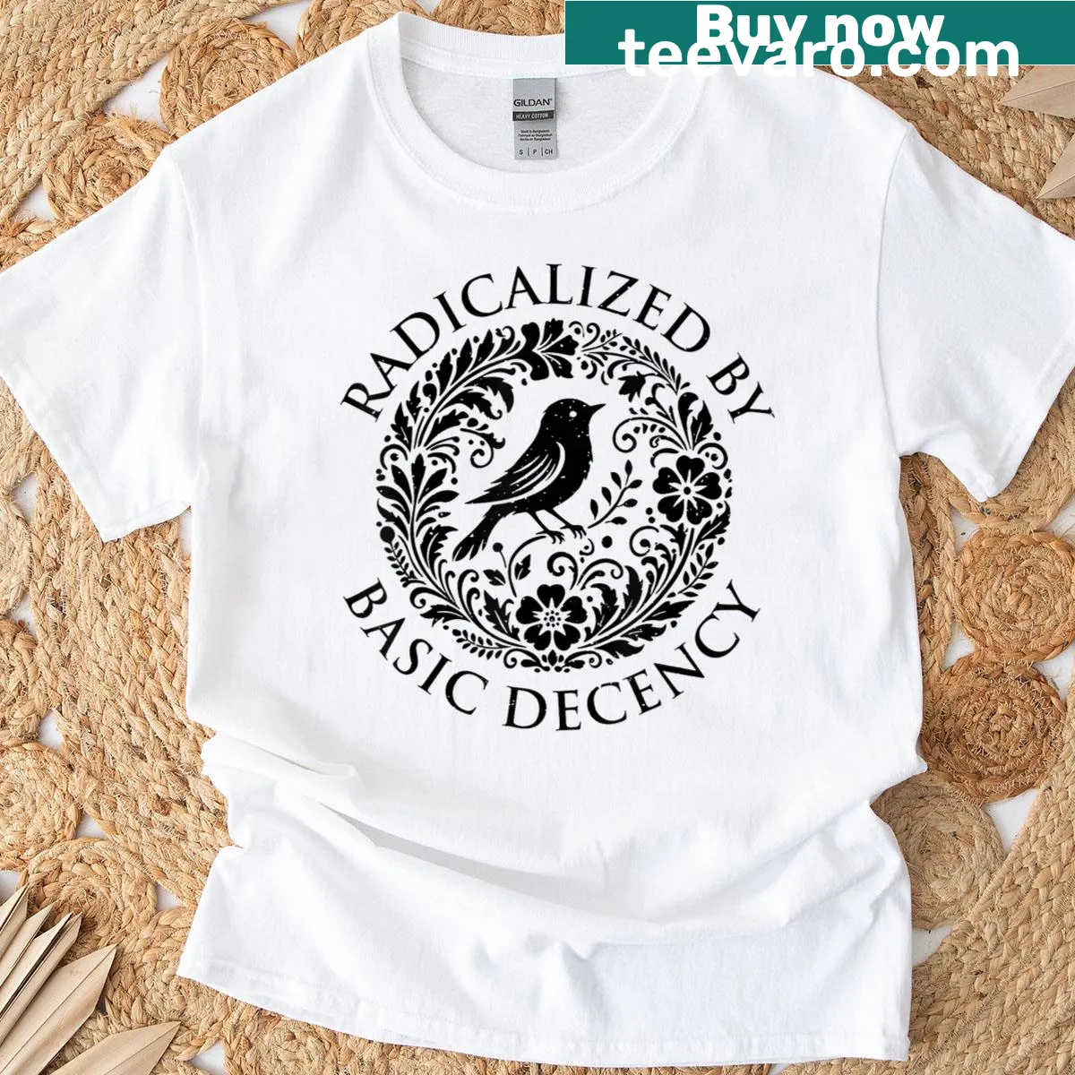 T-shirt featuring whimsical design with flowers, birds, and the phrase 'Radicalized By Basic Decency' — on a men's t-shirt