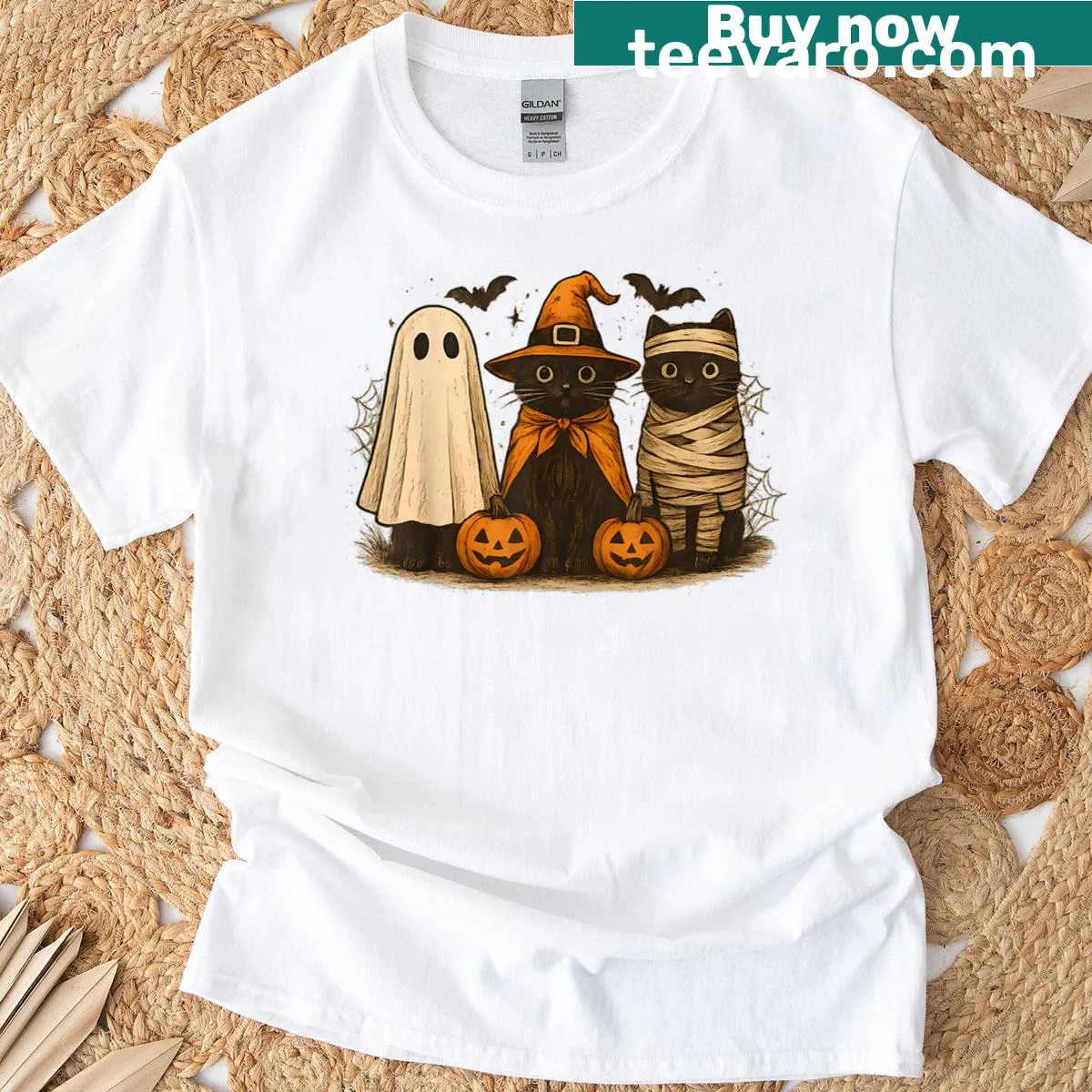 Vintage-style T-shirt featuring a cute black cat witch Halloween graphic — on a men's t-shirt