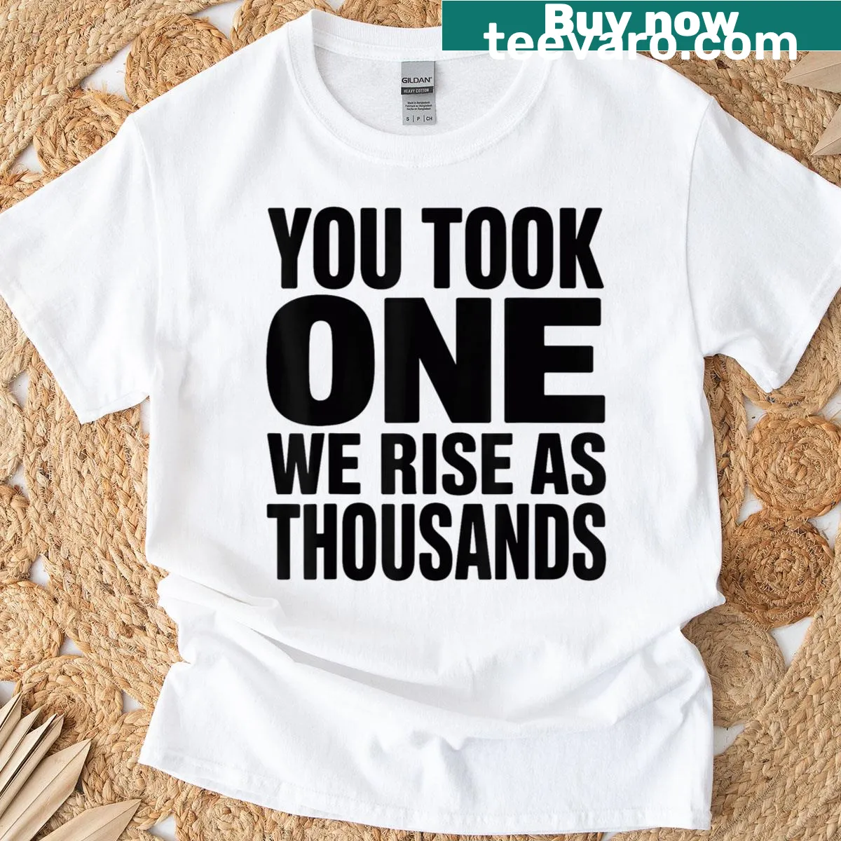 Patriotic quote T-shirt with the text We Rise As Thousands — on a men's t-shirt