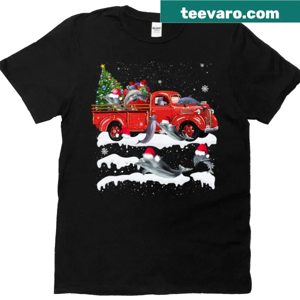 Christmas T-shirt depicting a dolphin riding in a red truck