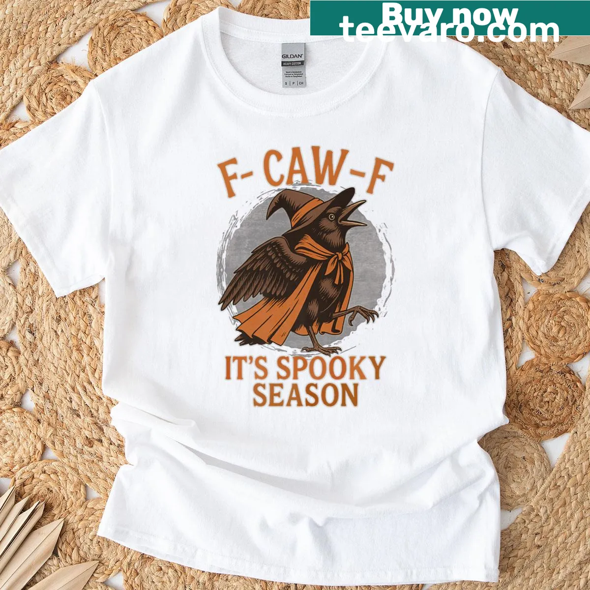 T-shirt featuring a crow dressed as a witch, perfect for Halloween. — on a men's t-shirt