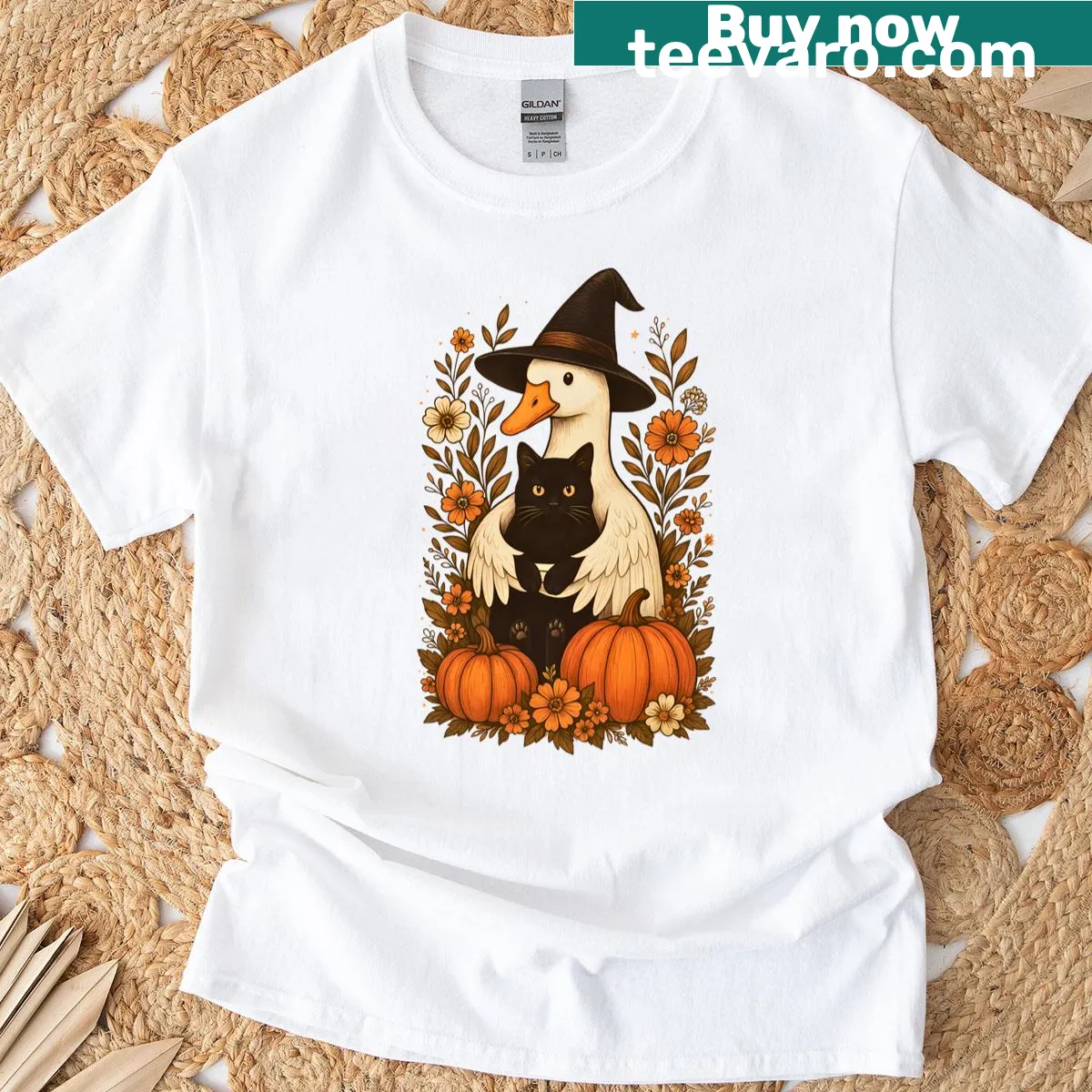 Cozy fall T-shirt with cat, goose, and pumpkins illustration — on a men's t-shirt