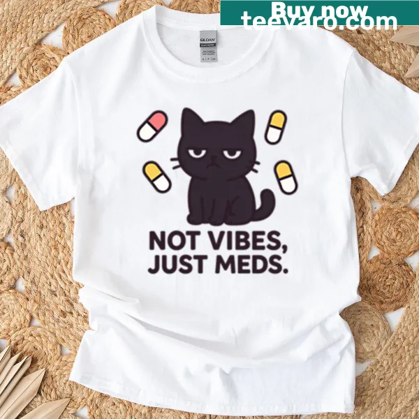 T-shirt with black cat illustration and humorous text about medications