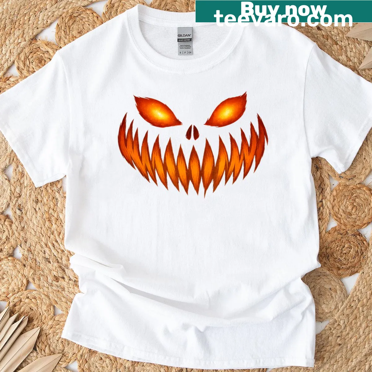Graphic of a scary carved pumpkin face on a T-shirt — on a men's t-shirt