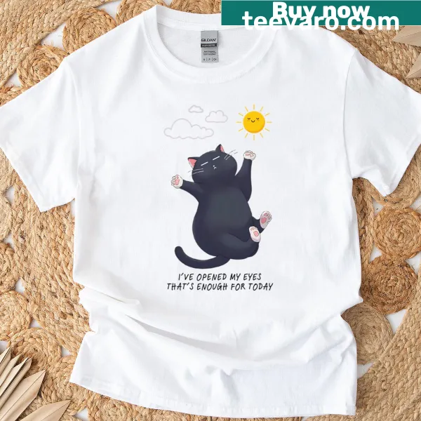 Cute cartoon t-shirt featuring a sleepy cat and the phrase 'Daily Achievement.'