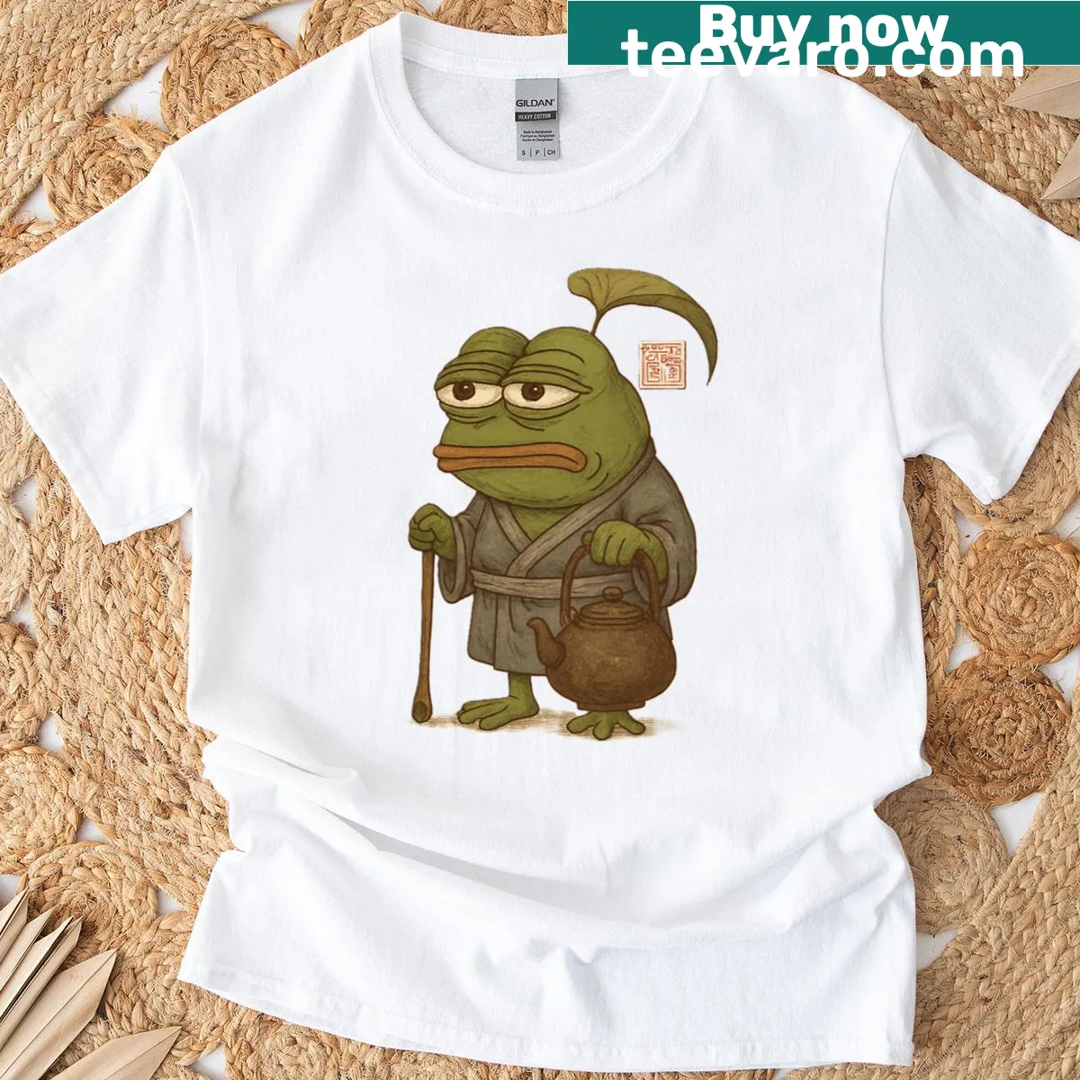 Oversized T-shirt featuring an illustration of an old frog master in Japan — on a men's t-shirt