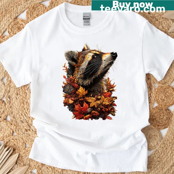Cute t-shirt featuring a raccoon with autumn leaves and flowers