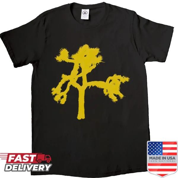 Silhouette of Joshua trees against a desert landscape on a shirt