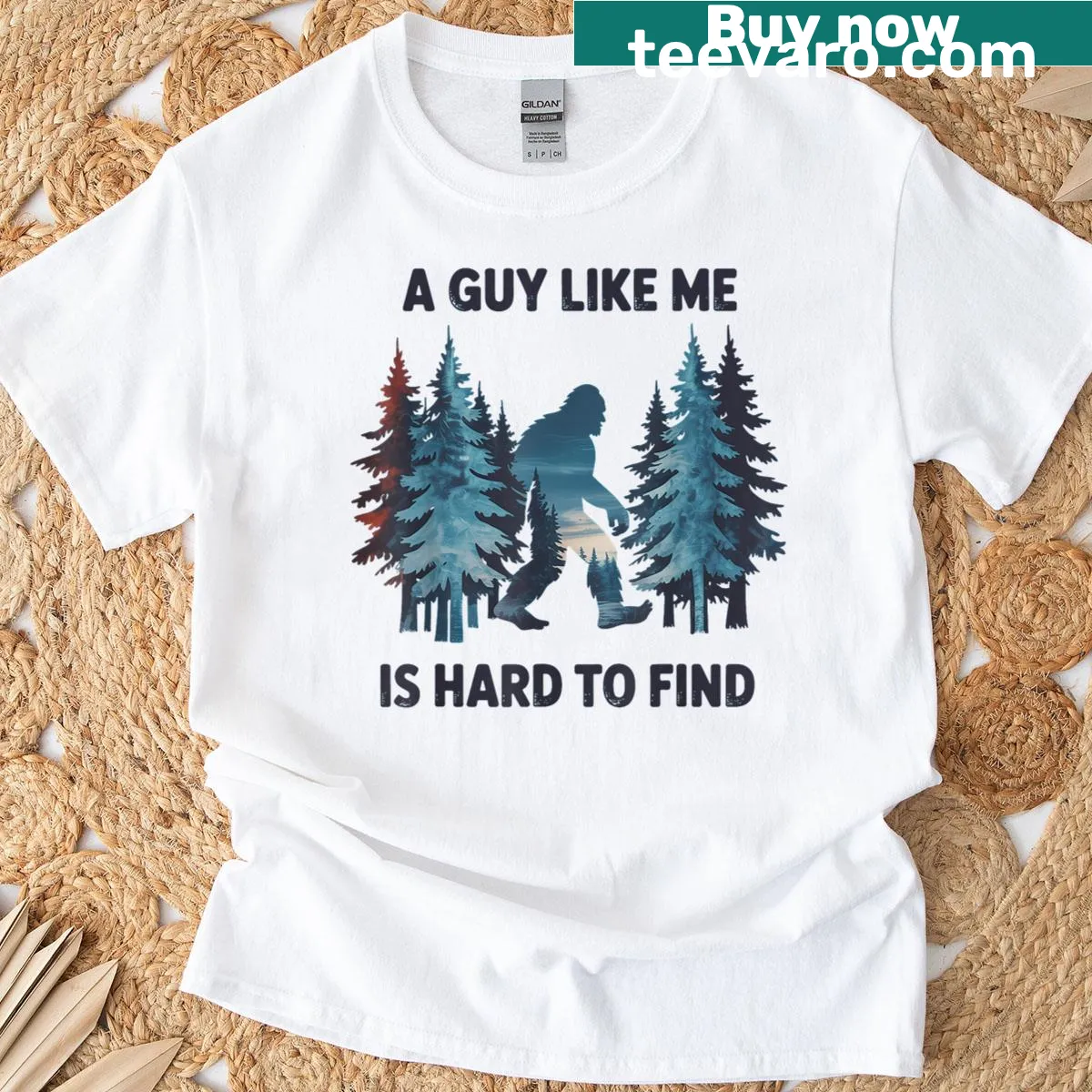 Cartoon T-shirt featuring Bigfoot and playful text about forest finding. — on a men's t-shirt