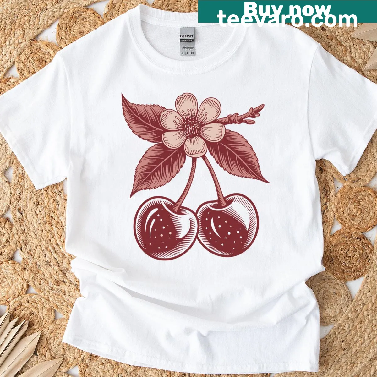 Vintage-style botanical tee with cherry and blossom design — on a men's t-shirt