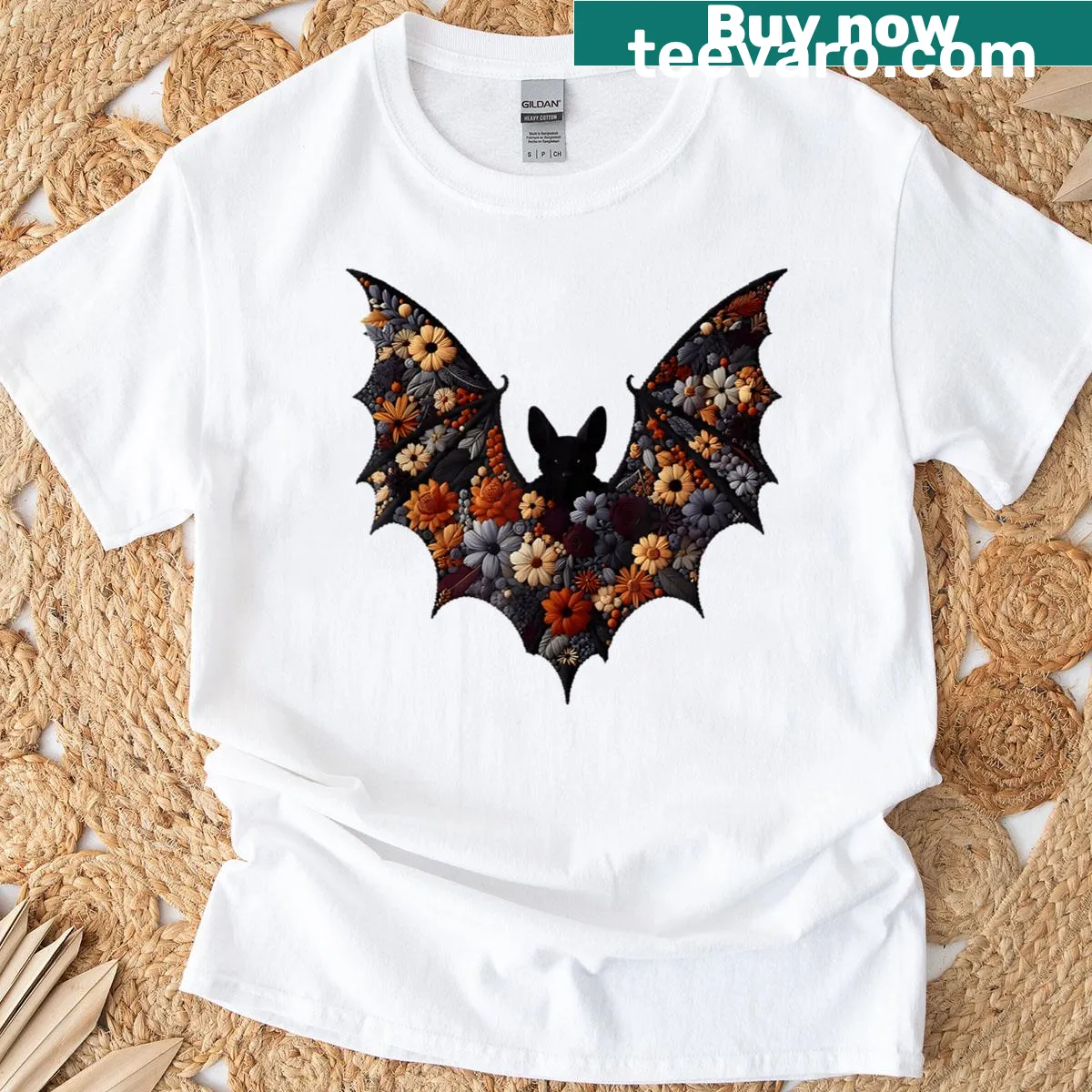 Gothic bat graphic with floral elements on vintage Halloween T-shirt — on a men's t-shirt