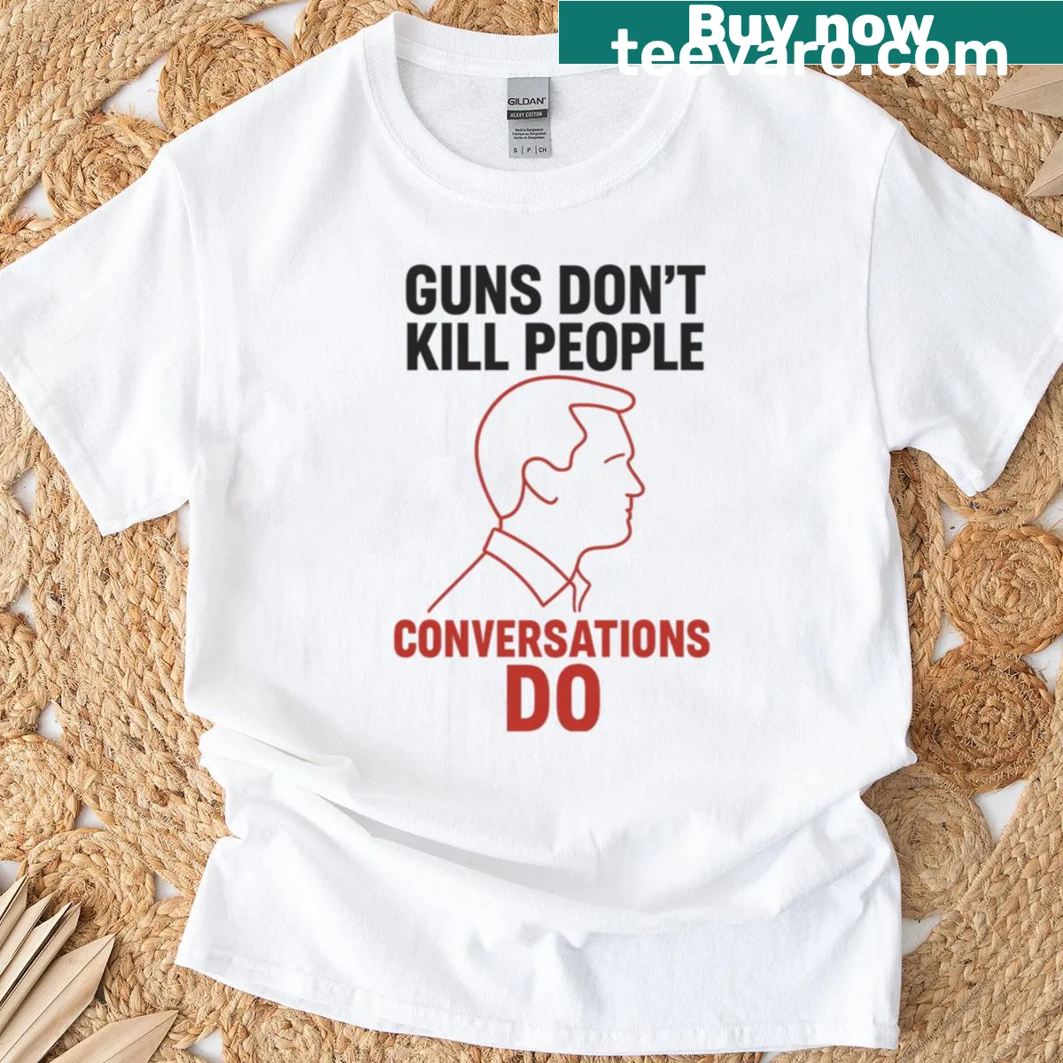 Oversized tee with bold outline text: Guns Don't Kill People, Conversations Do — on a men's t-shirt