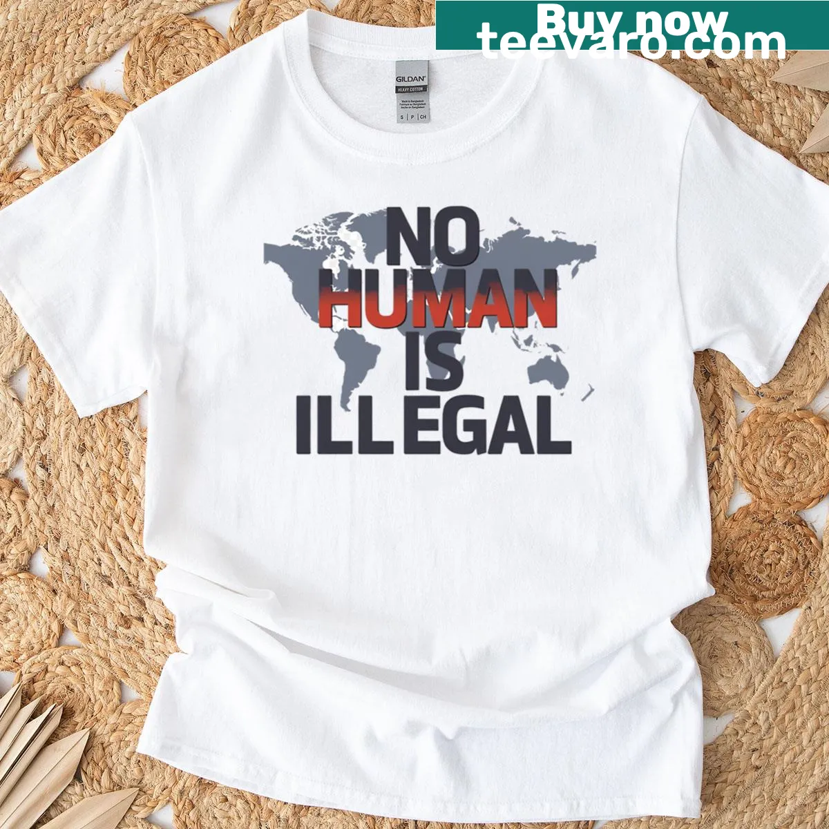 Oversized t-shirt with the phrase 'No Human Is Illegal' in bold text — on a men's t-shirt