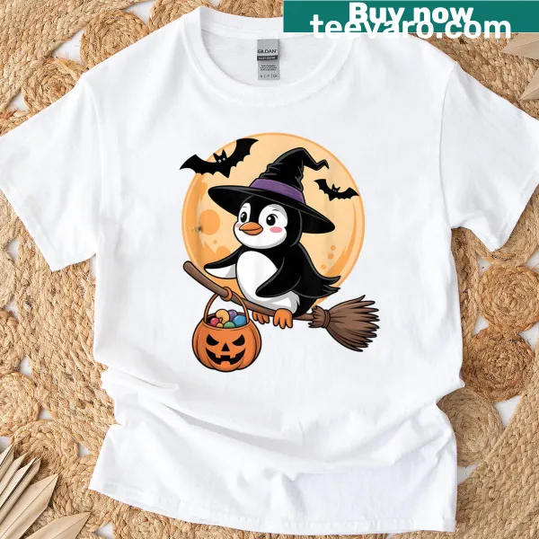Funny Halloween t-shirt featuring a penguin in a witch hat and pumpkins