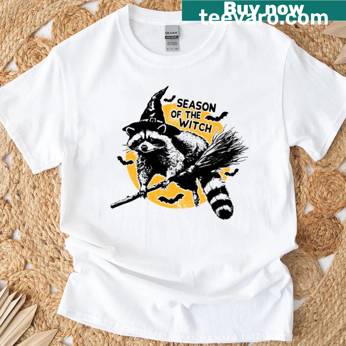 Funny Halloween T-shirt featuring a raccoon in a witch hat — on a men's t-shirt
