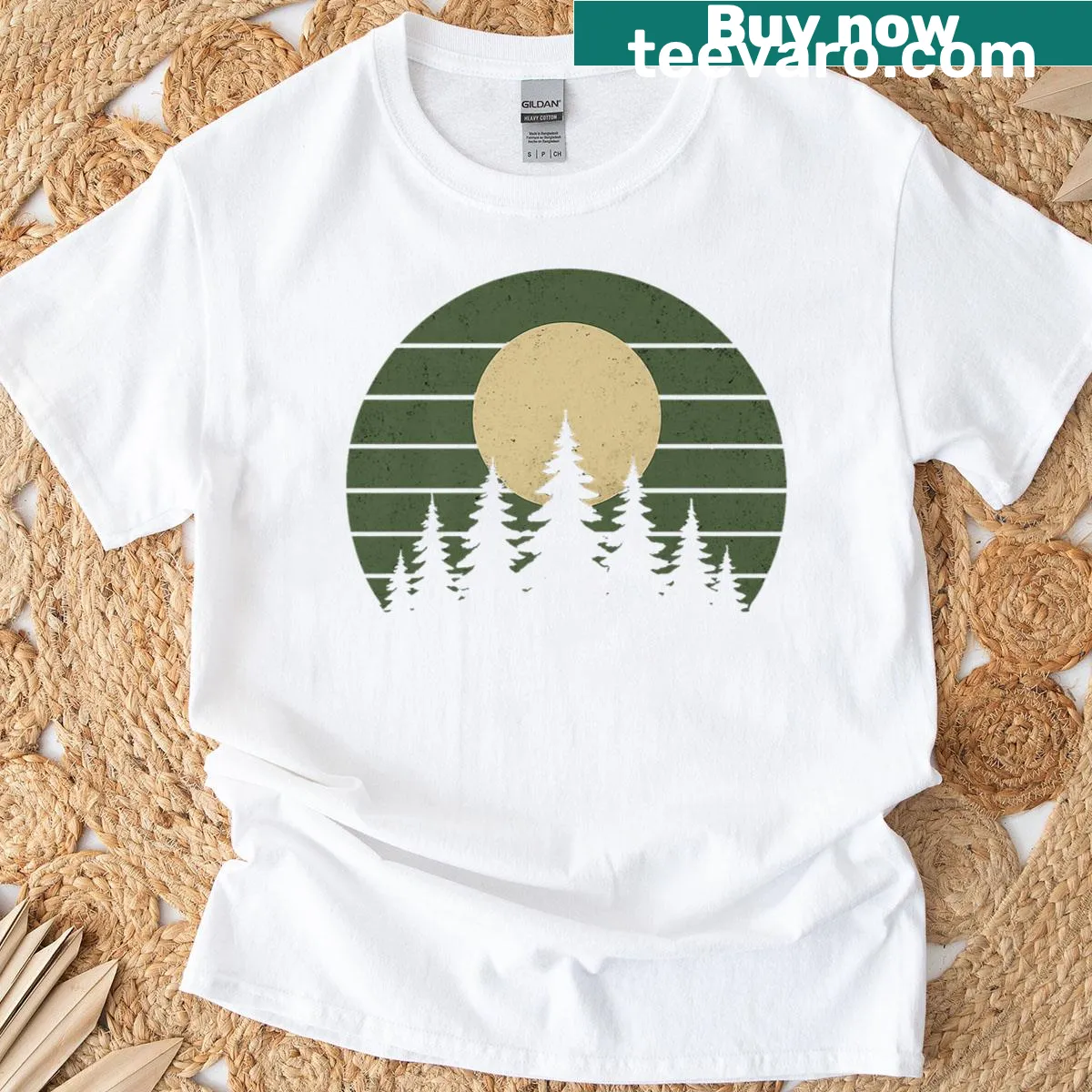 Vintage-style T-shirt featuring a serene forest and wildlife illustration — on a men's t-shirt