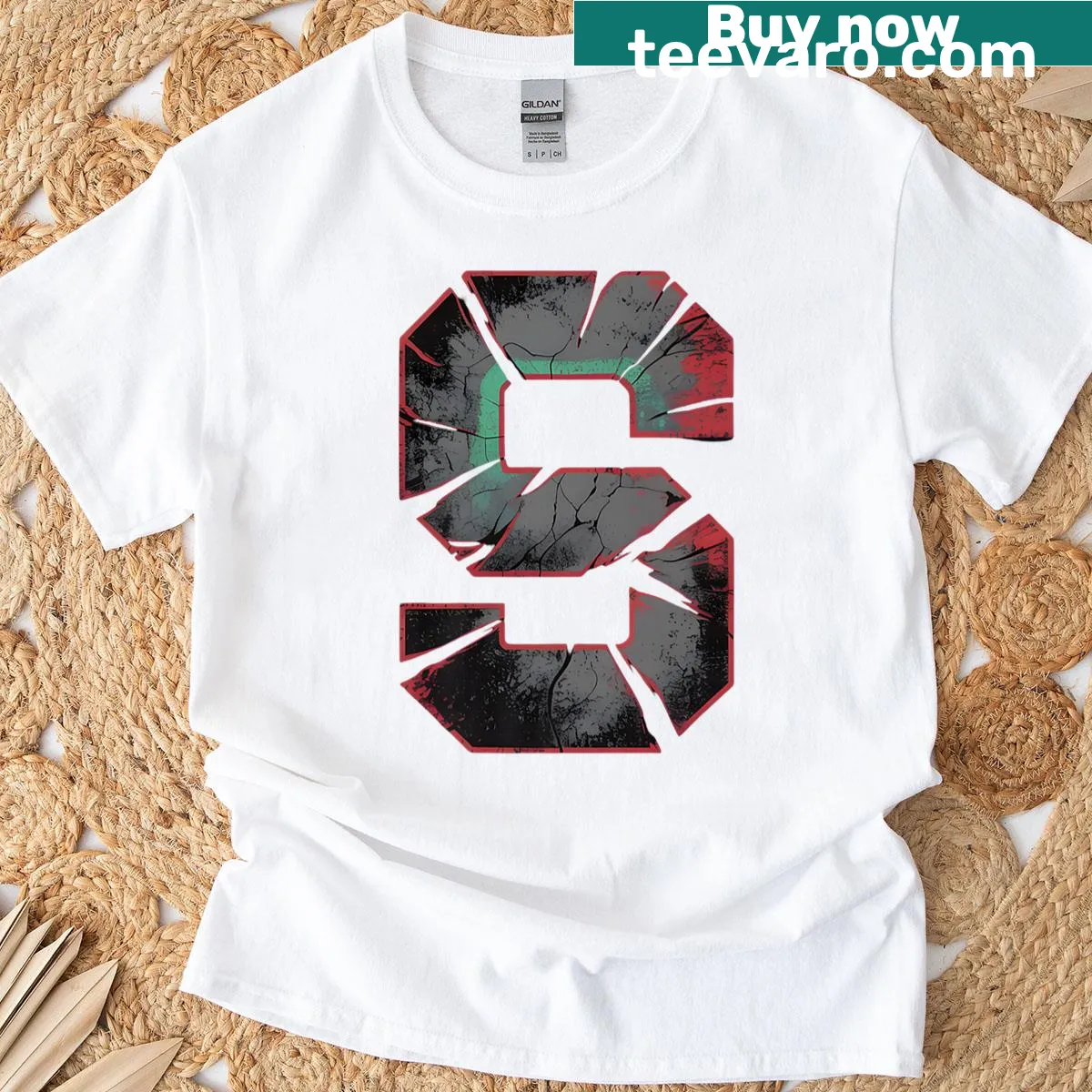 Vintage distressed T-shirt with red 'S' initial graphic — on a men's t-shirt