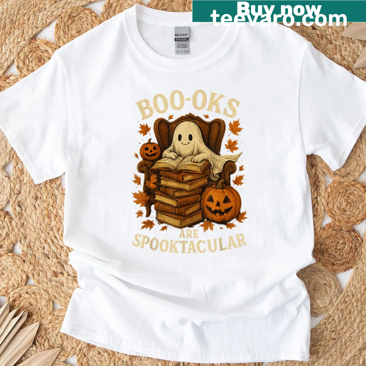 Halloween T-shirt featuring a ghost reading a book by a pumpkin — on a men's t-shirt