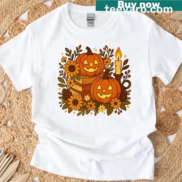 Vintage Halloween T-shirt with pumpkins, books, and sunflowers