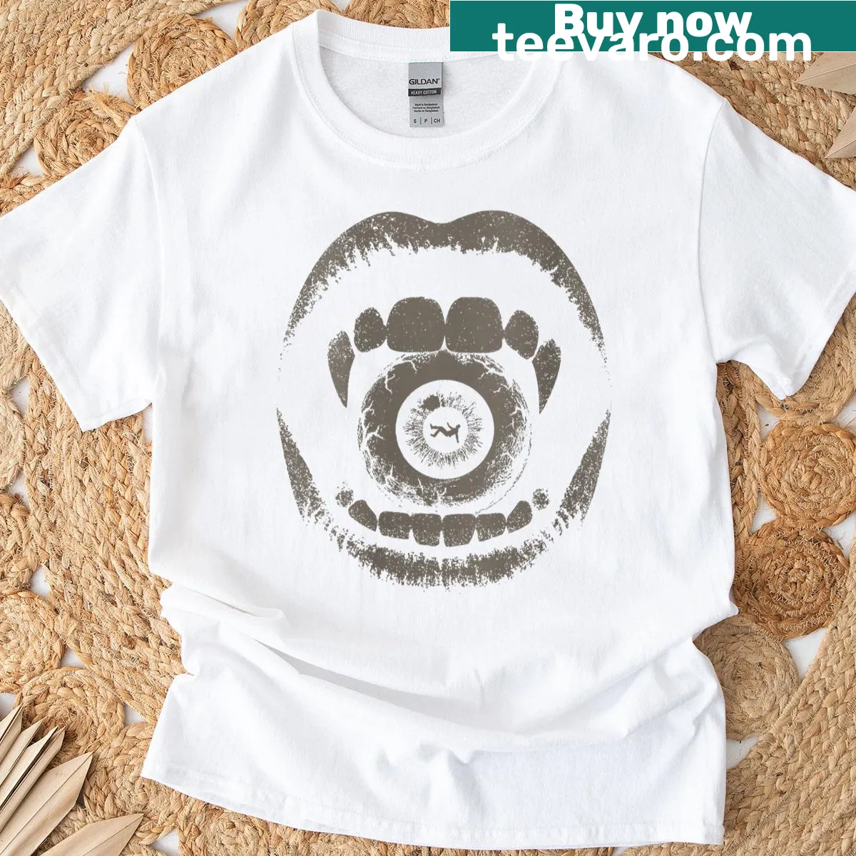 Vintage grunge T-shirt with vampire fangs and eyeballs graphic — on a men's t-shirt