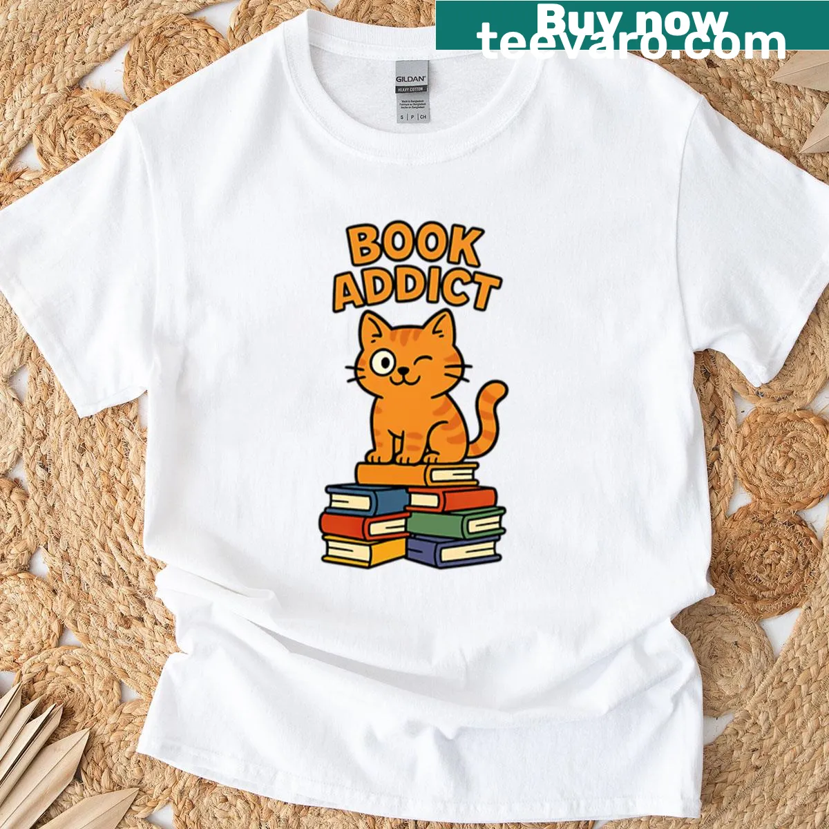 Cheeky cat on a stack of books illustration t-shirt — on a men's t-shirt