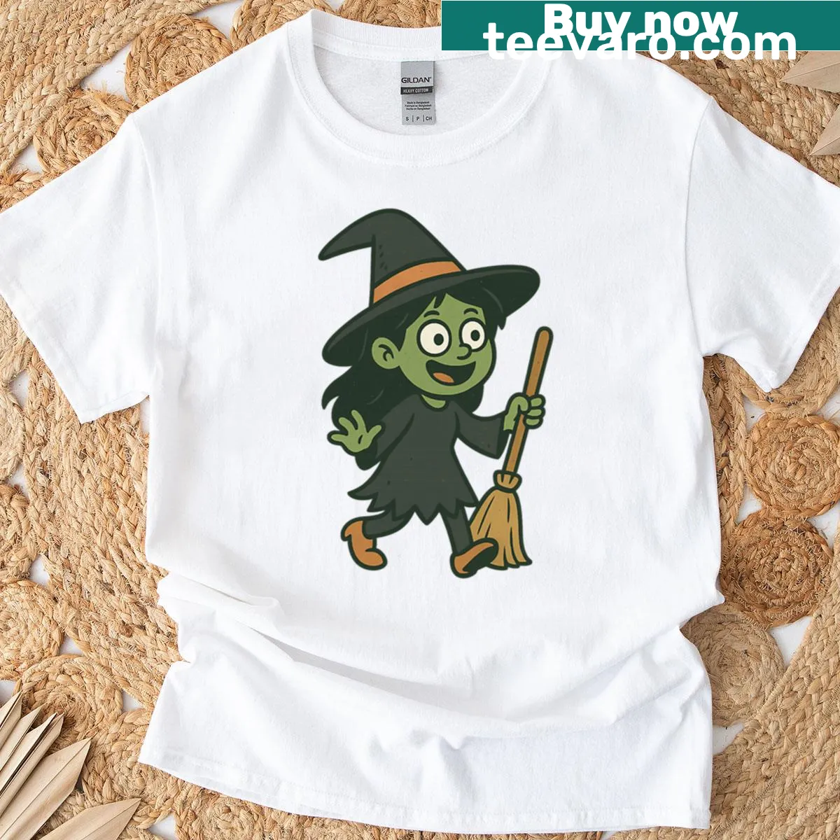 Cute green witch with broomstick illustration on t-shirt — on a men's t-shirt