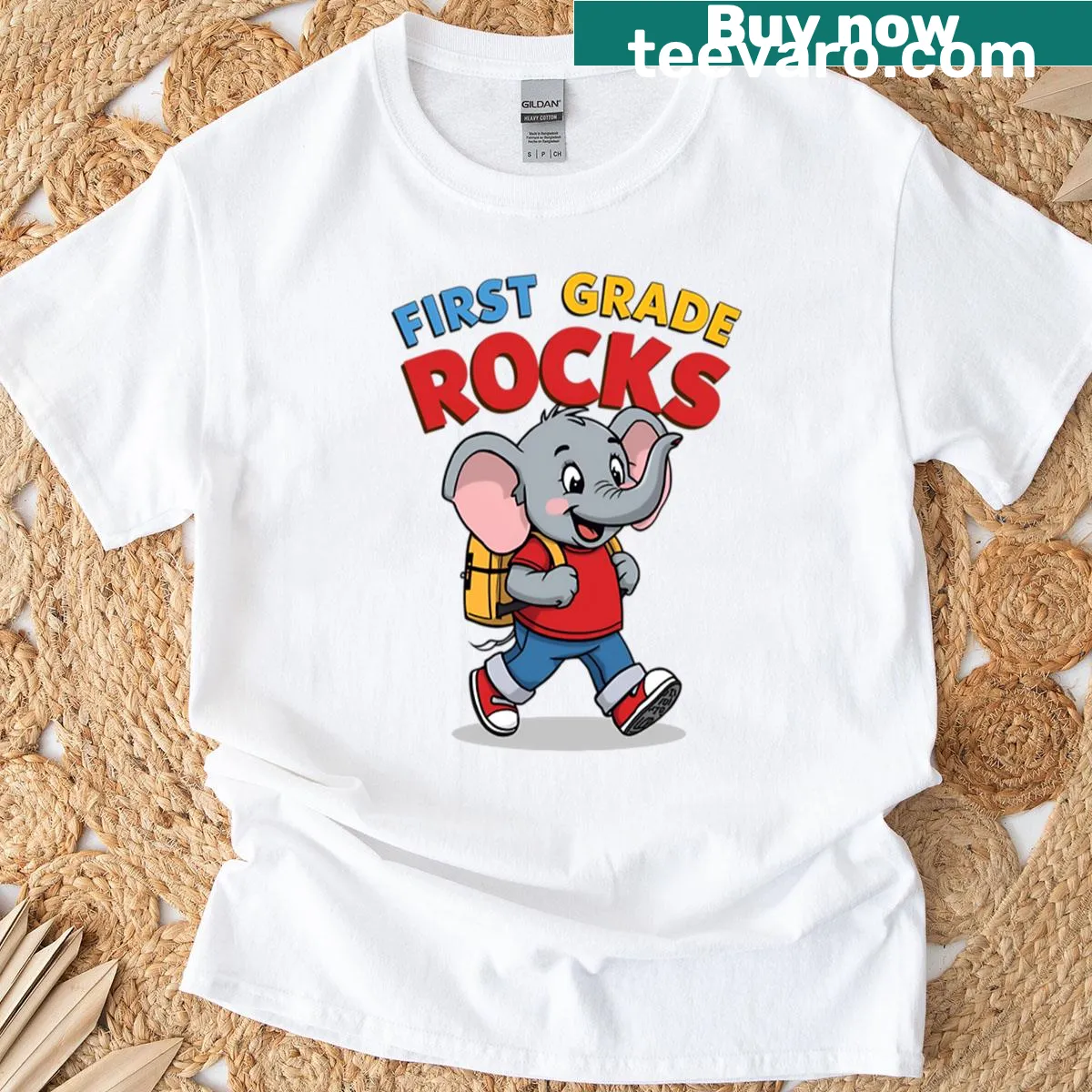 Cute cartoon elephant t-shirt with 'First Grade Rocks' text — on a men's t-shirt