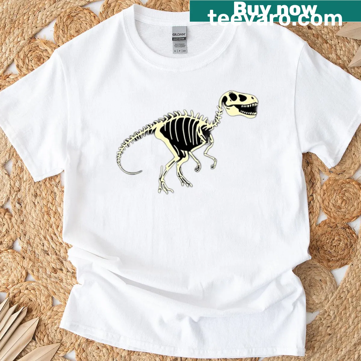 Glow-in-the-dark dinosaur skeleton graphic t-shirt — on a men's t-shirt