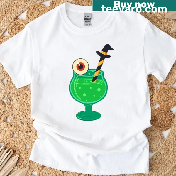 Halloween T-shirt featuring a green cocktail with eyeball and witch straw illustration