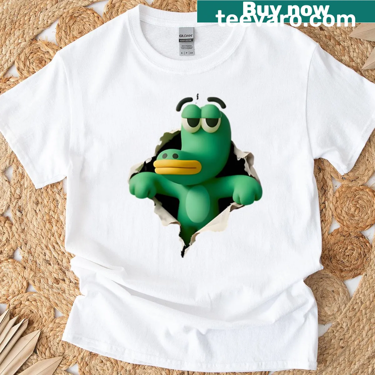 Oversized t-shirt featuring a quirky cartoon mascot bursting through paper — on a men's t-shirt